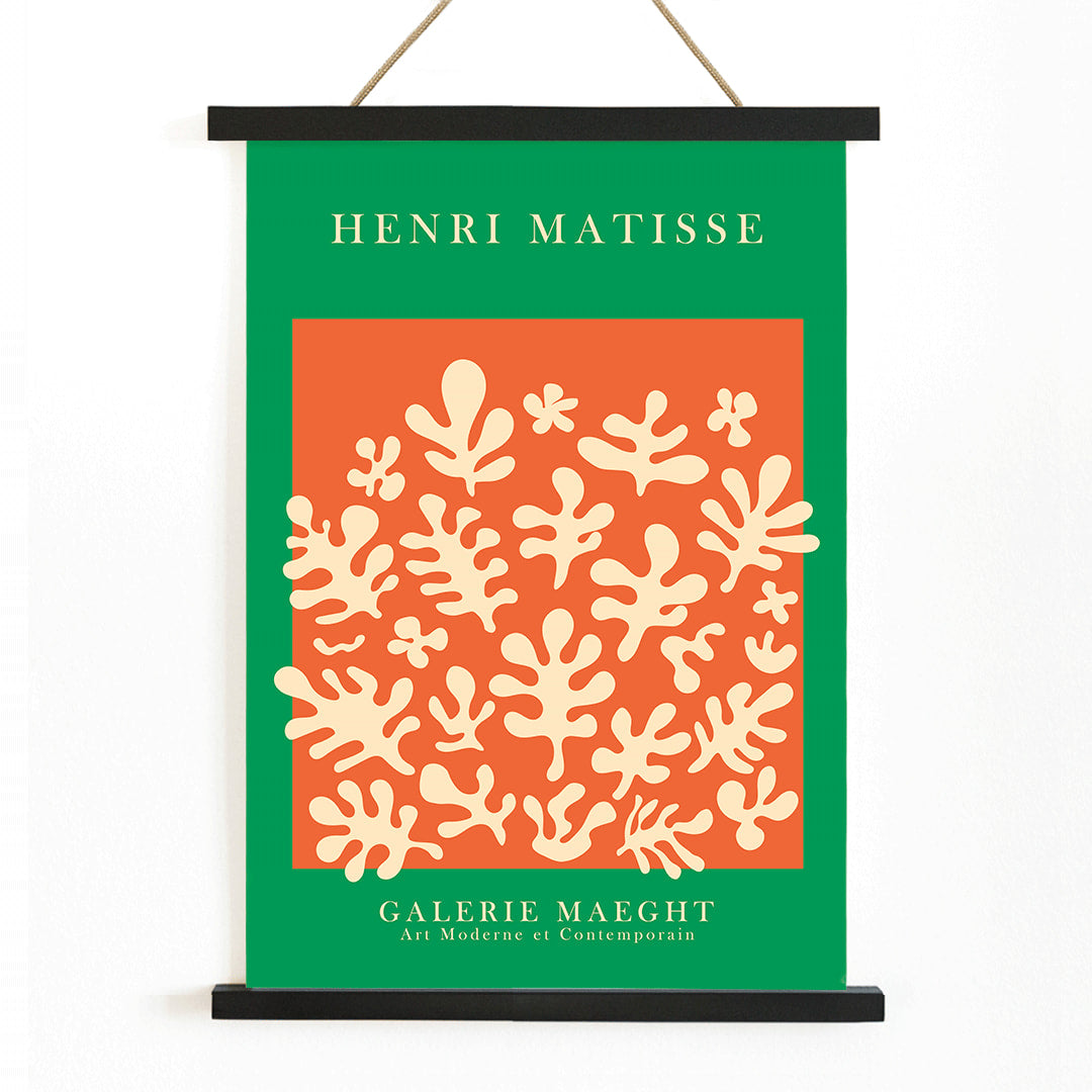 Henri Matisse artwork at Galerie Maeght featuring orange cut outs and abstract shapes on an orange background poster, with wooden magnetic frame on white background