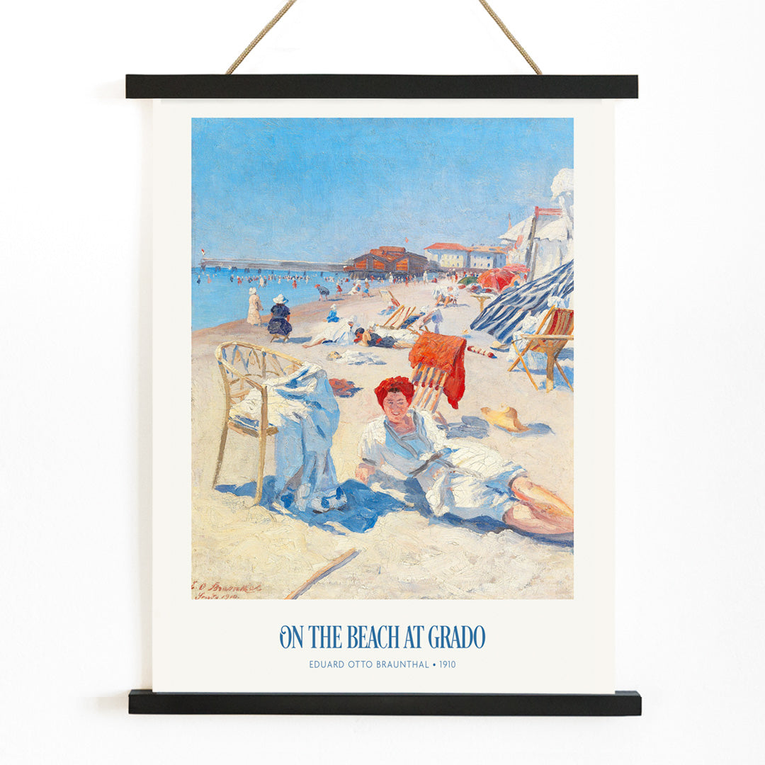 People relaxing on a sunny beach with chairs buildings and colorful umbrellas On the Beach at Grado by Eduard Otto Braunthal, with wooden magnetic frame on white background