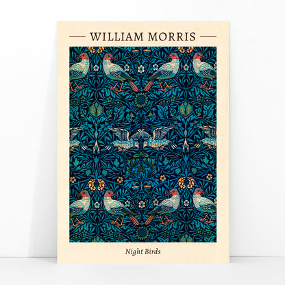 Night Birds by William Morris colorful patterned illustration and poster with intricate birds and floral designs in rich blue and green tones, framed and displayed in modern living room decor