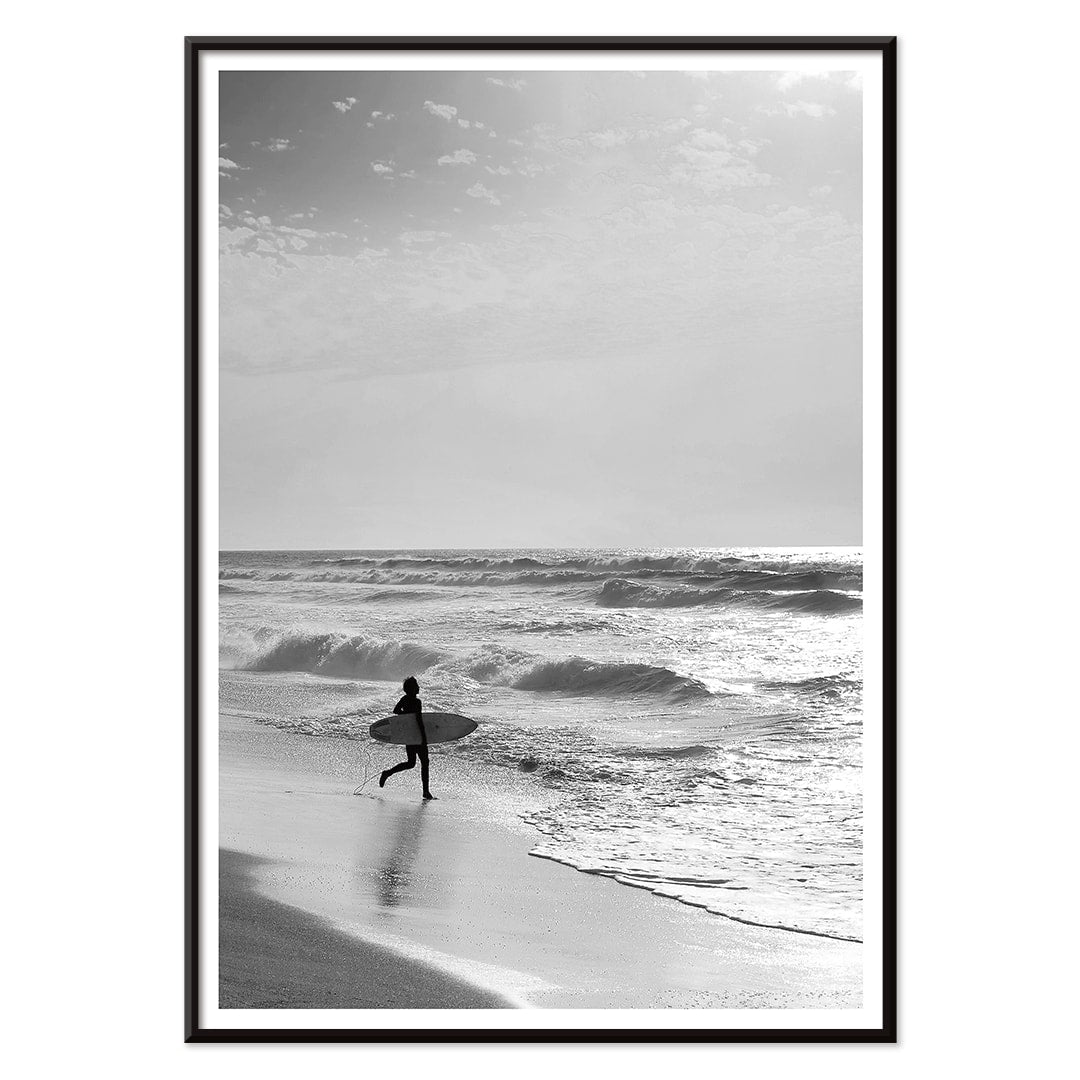 Black and white poster of a surfer with a board entering the ocean titled Surfer in Portugal by artist Black, with black aluminium frame on white background