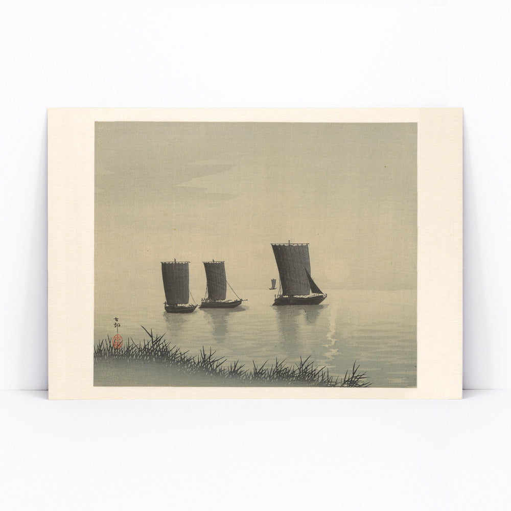 Serene Japanese art of three traditional fishing boats on calm water at sunset by Ohara Koson, framed and displayed in modern living room decor