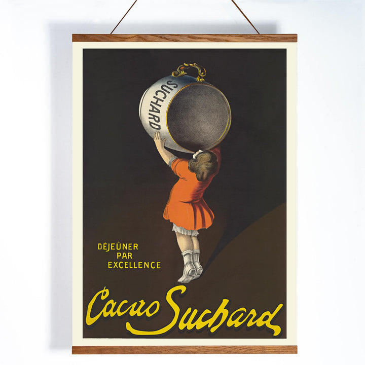 Leonetto Cappiello Cacao Suchard poster with girl lifting giant cocoa tin on dark background in orange dress and yellow lettering, with wooden magnetic frame on white background