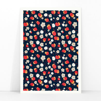 Colorful floral pattern poster with white gray pink and red flowers on dark background by Charles Goy, framed and displayed in modern living room decor
