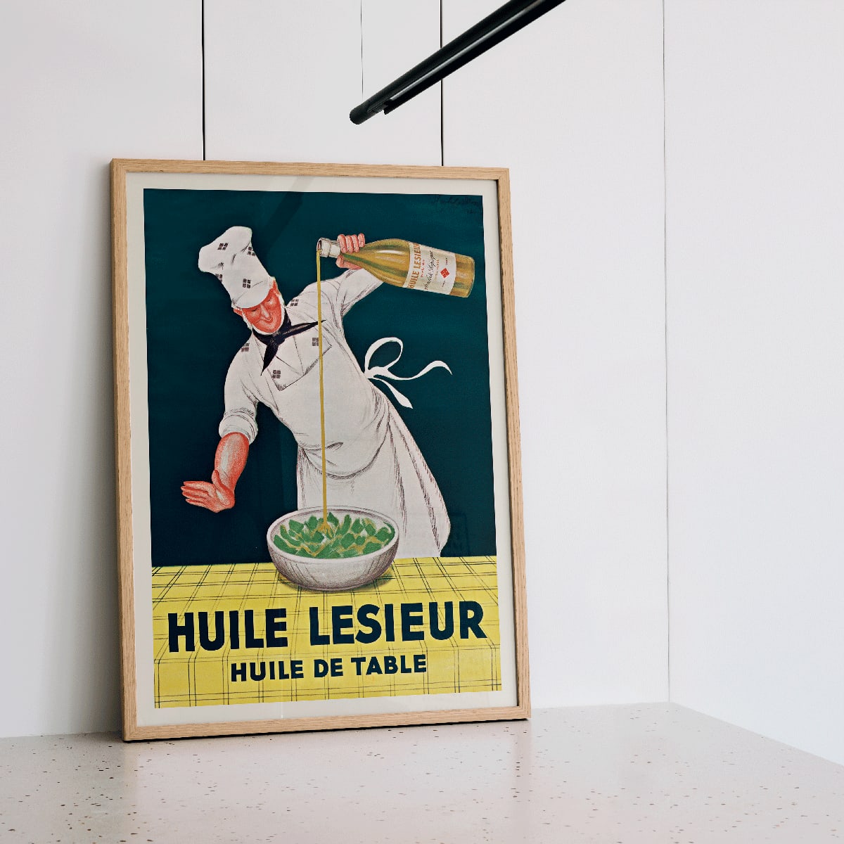Chef pouring oil into salad Huile Lesieur poster by Leonetto Cappiello, framed and displayed in home decor