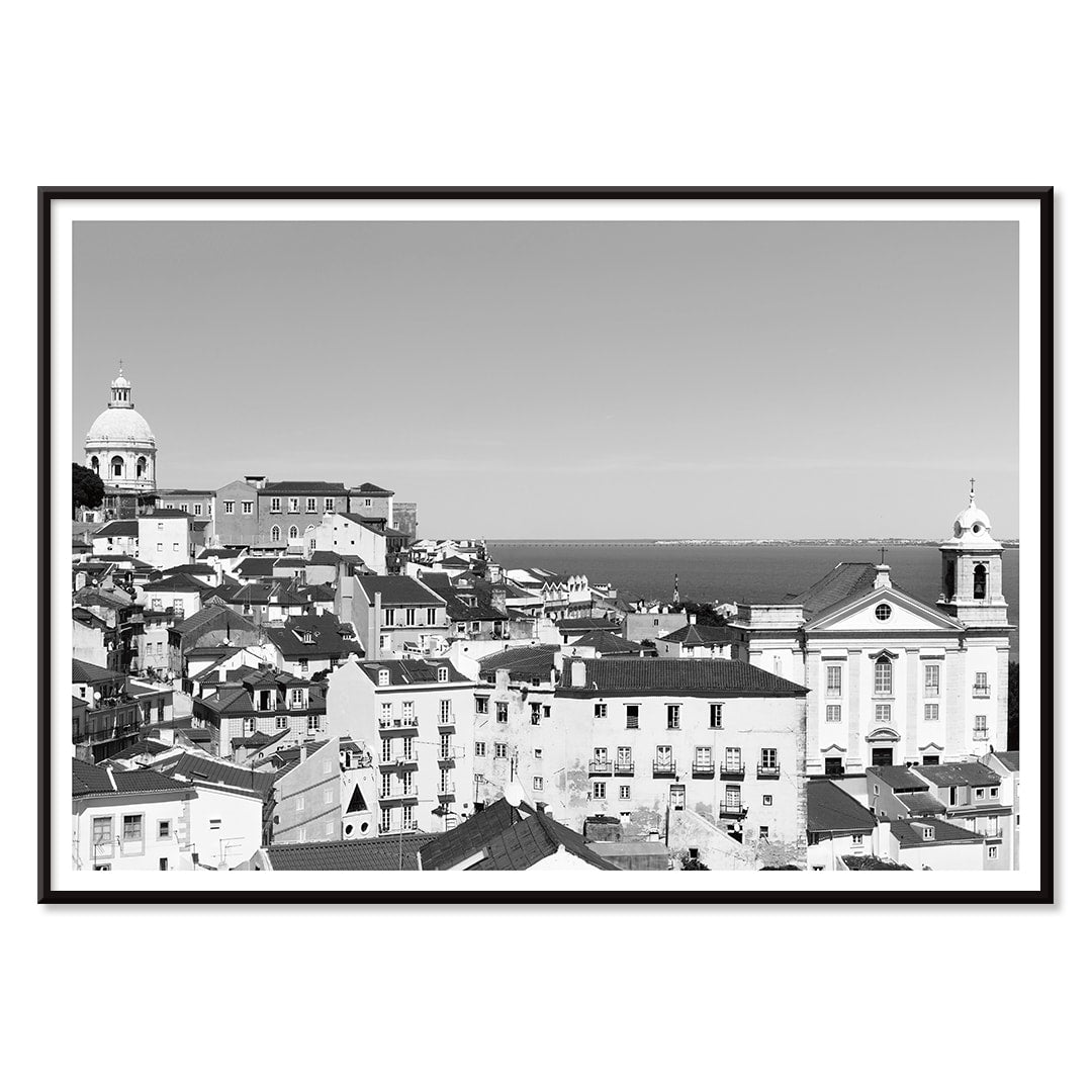 Black and white landscape of Lisbon Old City with historic architecture rooftops and distant sea view poster by Picture 2, with black aluminium frame on white background