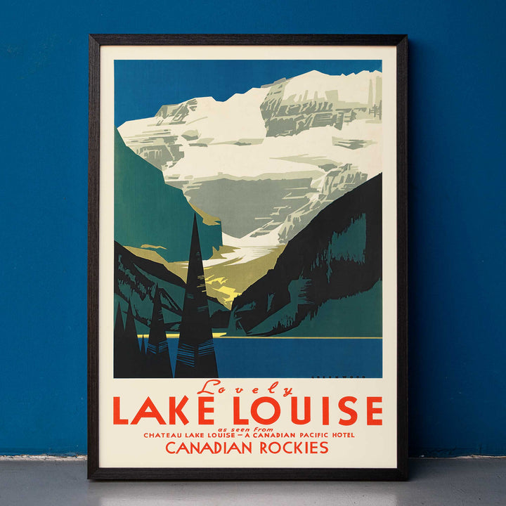 Lovely Lake Louise Canadian Pacific poster with snowy Canadian Rockies, pine trees and blue alpine lake in Canada, framed and displayed in home decor