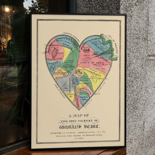 Open Country of Womans Heart poster by E.B. and E.C. Kellogg, colorful heart shaped map with labeled regions, vintage cartographic style, framed and displayed in home decor