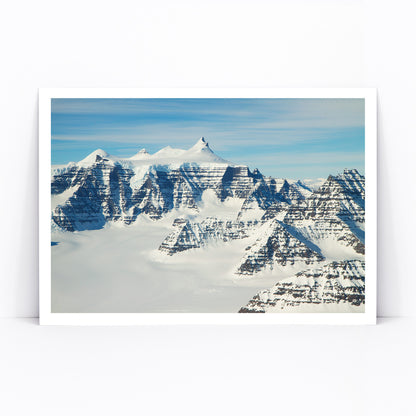 Snow covered mountain ridges and unique geology of the Geikie Plateau eastern Greenland by NASA poster, framed and displayed in modern living room decor