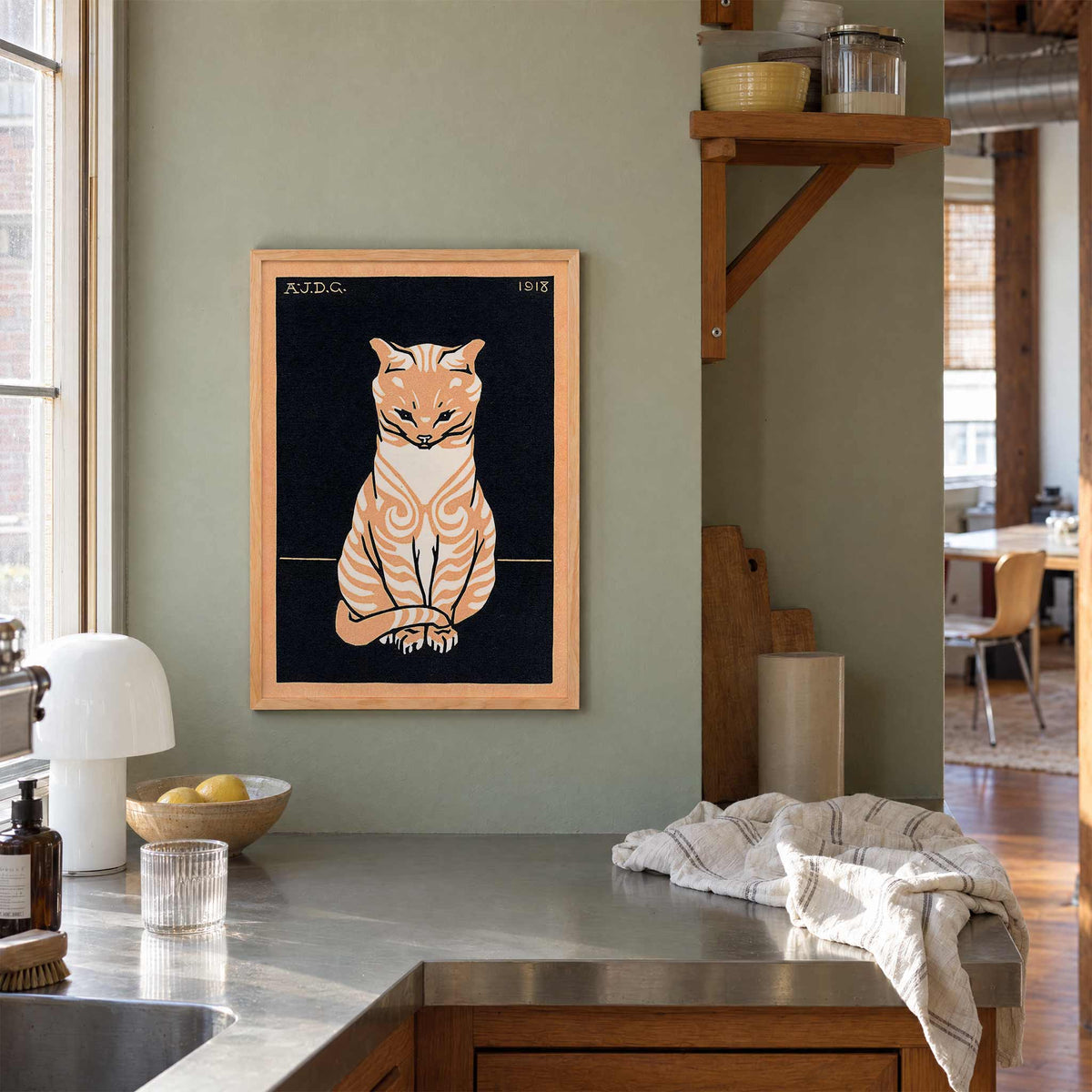 Julie de Graag Orange Seated Cat poster with striped tabby, pale chest and curled tail on black background, with wooden magnetic frame on white background