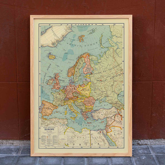 Rand McNally and Company Political Map of Europe poster with detailed continental map, colored borders, seas, and vintage cartographic typography, framed and displayed in home decor
