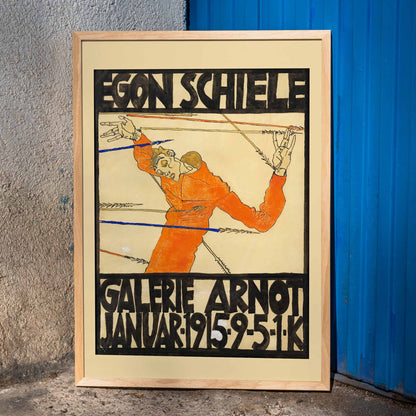 Expressionist poster by Egon Schiele featuring a contorted orange figure with bold black text Schiele-Ausstellung in der Galerie Arnot, framed and displayed in home decor