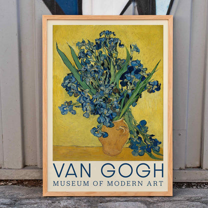 Irises by Vincent van Gogh vibrant blue irises in a rustic vase on a bright yellow background poster art, framed and displayed in home decor