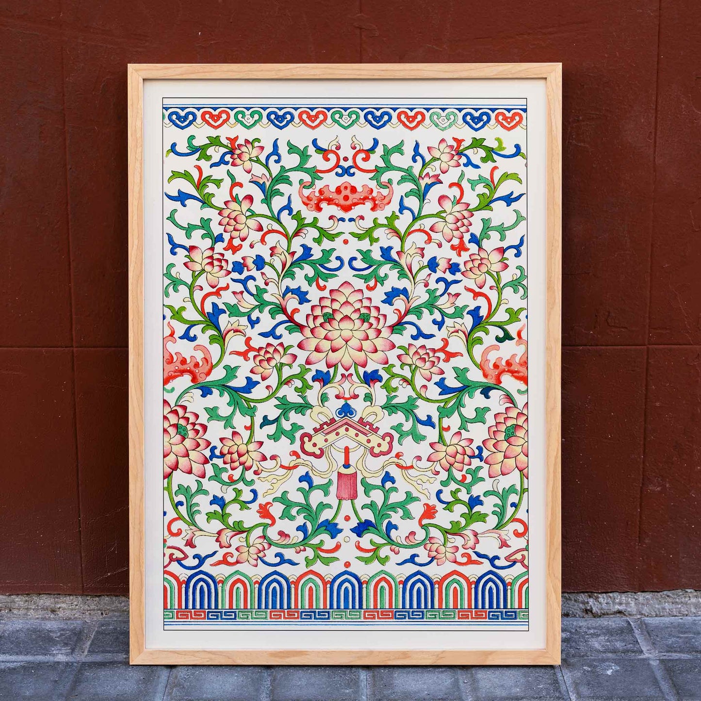 Chinese botanical illustration and botanical poster by Owen Jones from Examples of Chinese Ornament featuring intricate floral patterns and vibrant colors, framed and displayed in home decor
