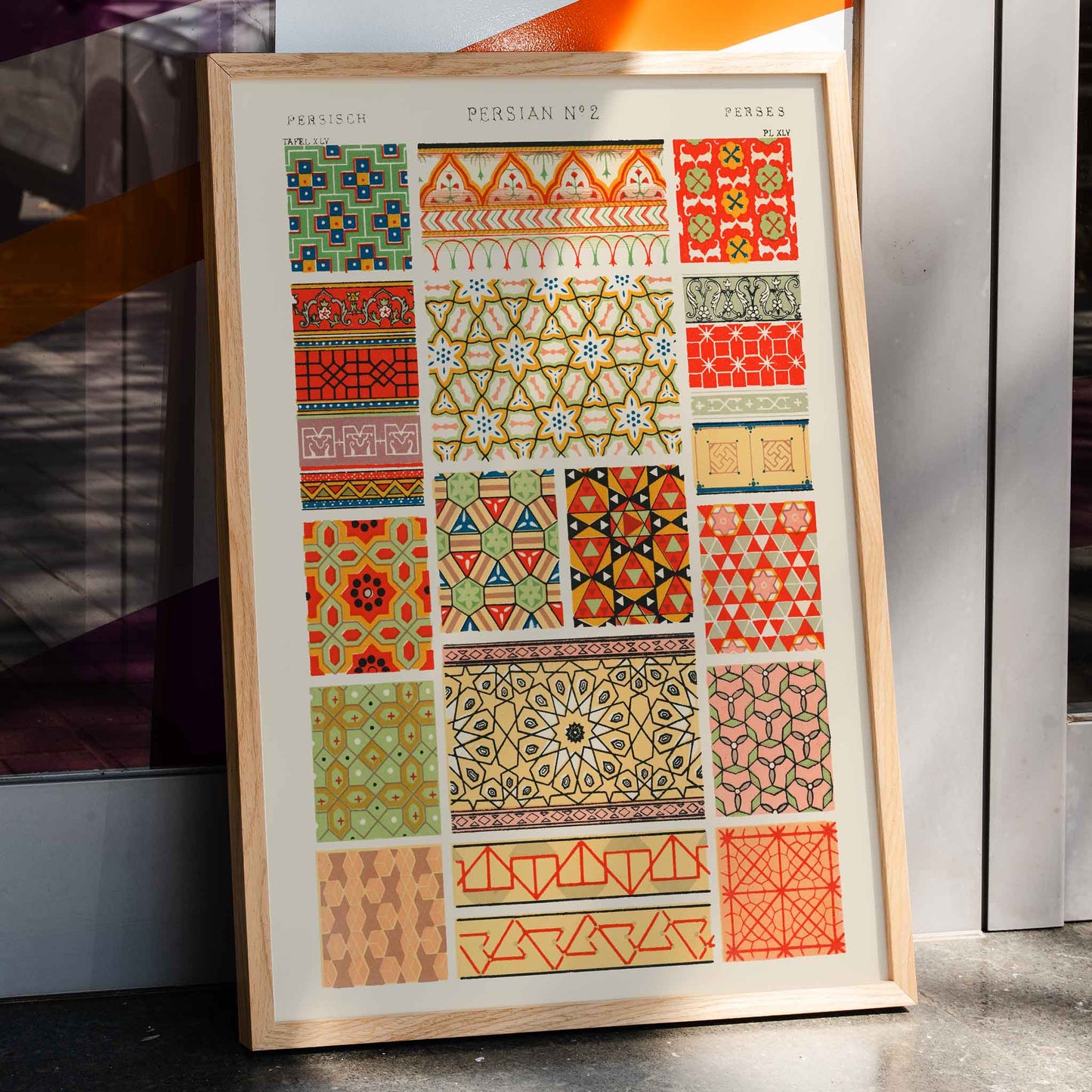 Poster of Persian 2 vintage pattern from Grammar of Ornament by Owen Jones with intricate and colorful geometric designs, framed and displayed in home decor
