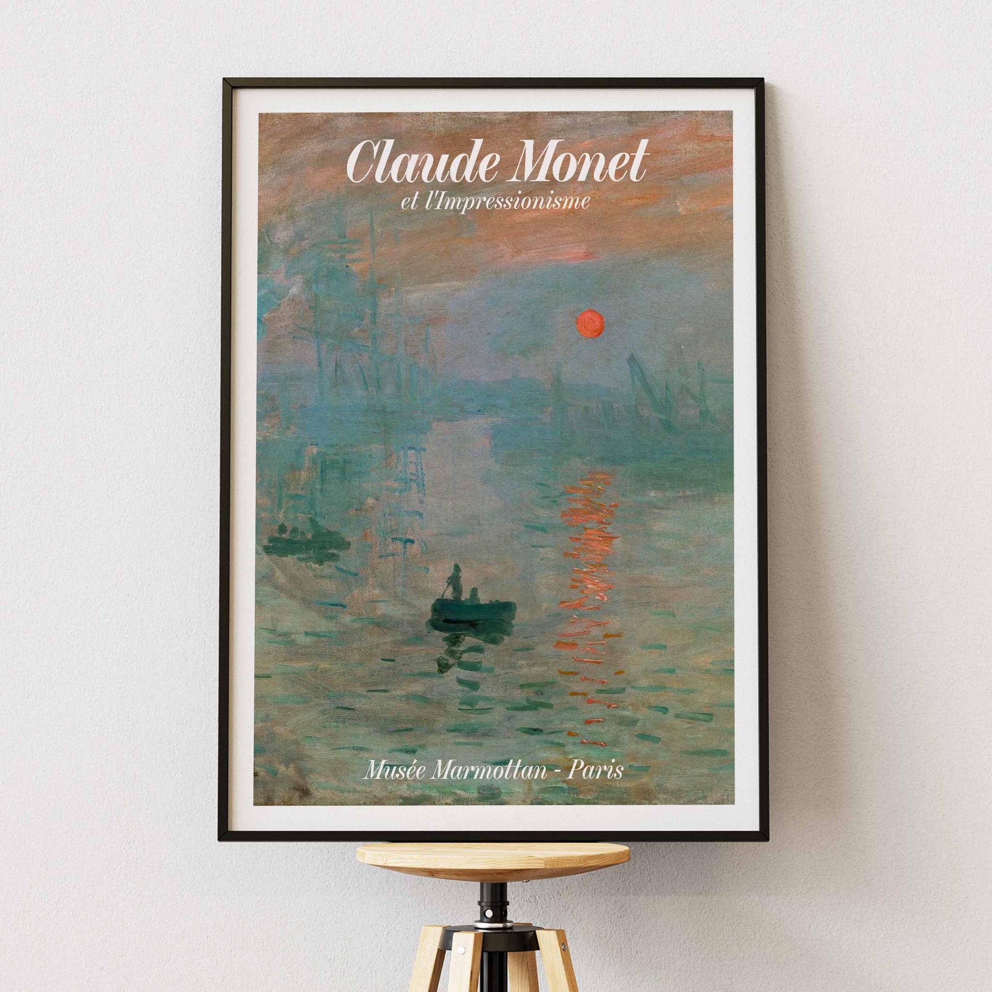 Claude Monet Soleil Levan exhibition poster vibrant impressionist artwork with red sun over water, with wooden magnetic frame on white background