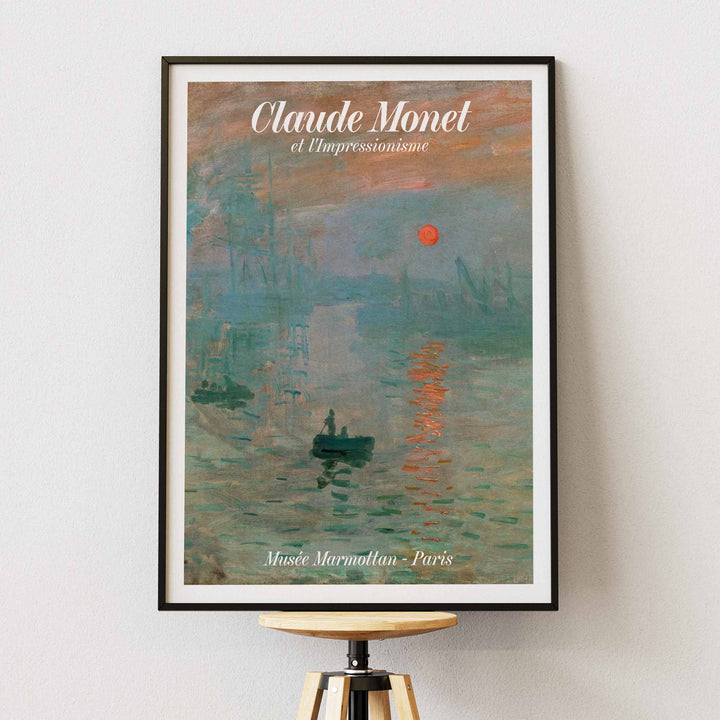 Claude Monet Soleil Levan exhibition poster vibrant impressionist artwork with red sun over water, with wooden magnetic frame on white background