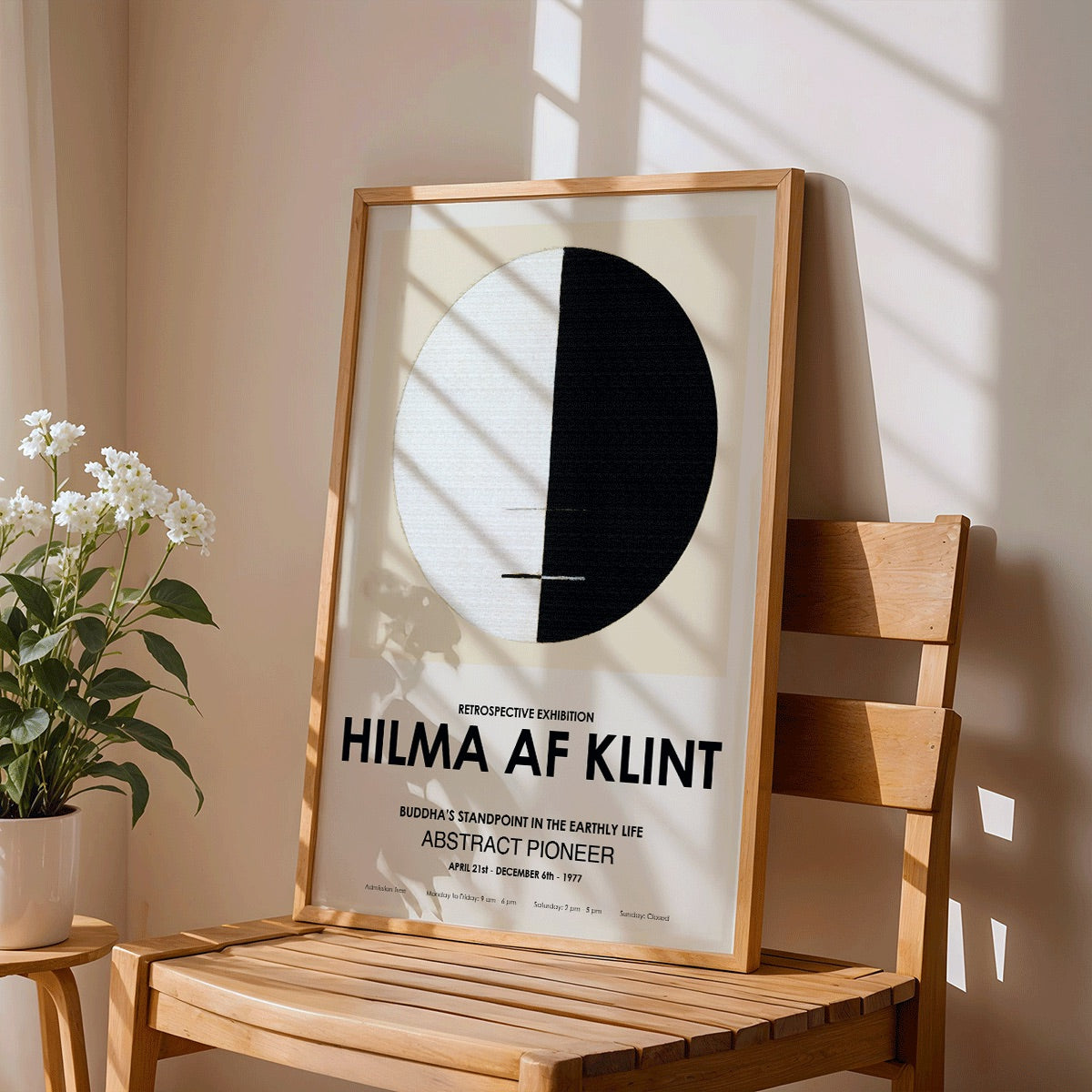 Exhibition poster Buddhas Standpoint in the Earthly Life by Hilma Af Klint featuring abstract black and white circle design artwork, framed and displayed in modern living room decor