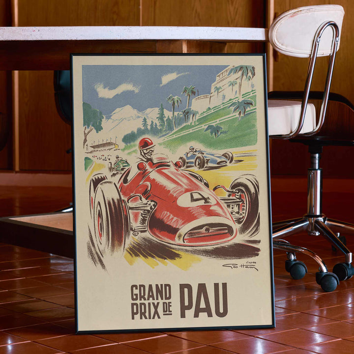 Georges Hamel Grand Prix de Pau poster with red racing car on a sunlit circuit near green hills and mountain castle, with wooden magnetic frame on white background